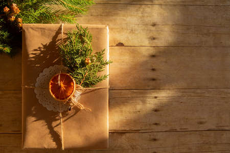 Christmas gift wrapped in vintage craft paper. flatlayの写真素材