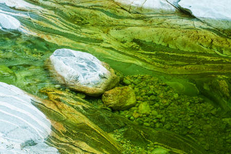 Rocks underneath stream riverの写真素材