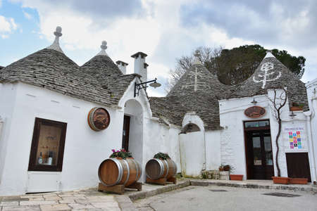 ALBEROBELLO, ITALY - FEBRUARY 11, 2019. Visiting unique houses of Alberobello, Puglia region, Italy