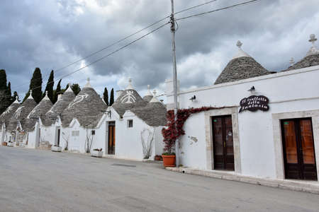 ALBEROBELLO, ITALY - FEBRUARY 11, 2019. Visiting unique houses of Alberobello, Puglia region, Italyのeditorial素材