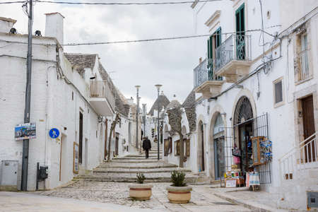 ALBEROBELLO, ITALY - FEBRUARY 11, 2019. Visiting unique houses of Alberobello, Puglia region, Italyのeditorial素材