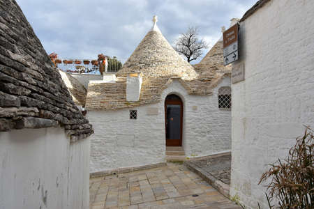 ALBEROBELLO, ITALY - FEBRUARY 11, 2019. Visiting unique houses of Alberobello, Puglia region, Italyのeditorial素材