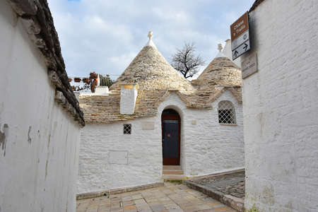 ALBEROBELLO, ITALY - FEBRUARY 11, 2019. Visiting unique houses of Alberobello, Puglia region, Italyのeditorial素材
