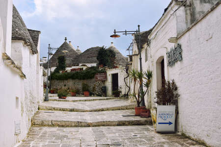 ALBEROBELLO, ITALY - FEBRUARY 11, 2019. Visiting unique houses of Alberobello, Puglia region, Italyのeditorial素材