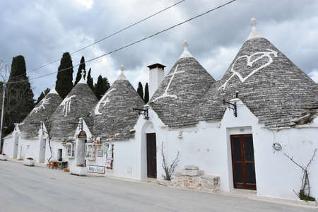 ALBEROBELLO, ITALY - FEBRUARY 11, 2019. Visiting unique houses of Alberobello, Puglia region, Italyのeditorial素材