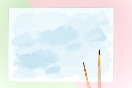 Watercolor drawing in blue, paint brushes on paperの写真素材