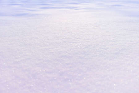 Snow, snow cover in the rays of sunset with defocus light, with focus and defocus zonesの写真素材