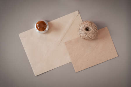 Envelopes, a rope and an ex-libris are fixed on a leather substrate. flatlay.の写真素材