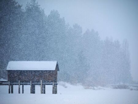 Cabin Isolated in Heavy Snowの写真素材