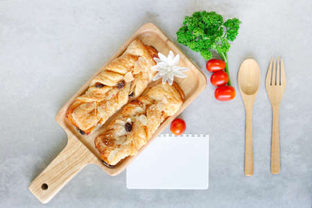 Bread crisp danish with raisins and almond, There is a note padの写真素材