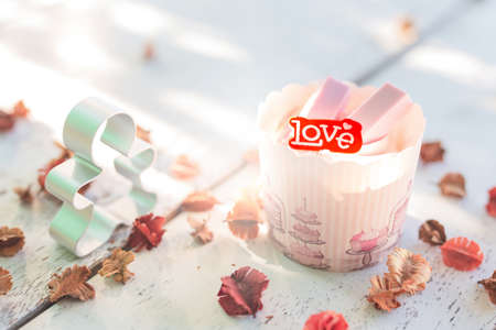 Cupcakes sweet bakery for love valentine's day. Put on a white wood floorの写真素材