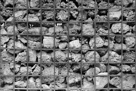 Stone wall with large steel mesh Can be used to make backgroundsの写真素材