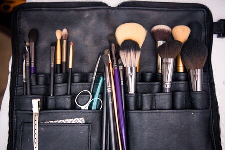 Variety of cosmetologist makeup brushes in black leather caseの写真素材