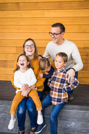 Young family laughs together during portrait sessionの写真素材