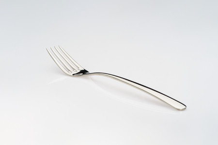 Steel fork isolated on white backgroundの写真素材