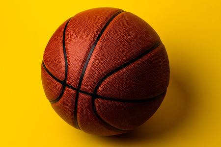 basketball ball on yellow background.の写真素材