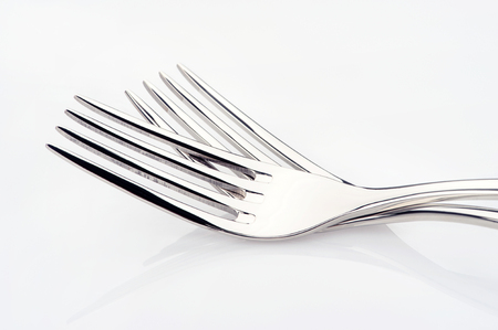 Steel fork isolated on white backgroundの写真素材
