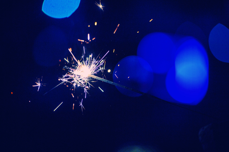 christmas sparkler glowing in the darkの写真素材