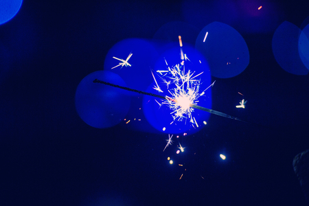 christmas sparkler glowing in the darkの写真素材