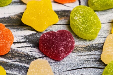 Tasty jelly candies on wooden backgroundの写真素材
