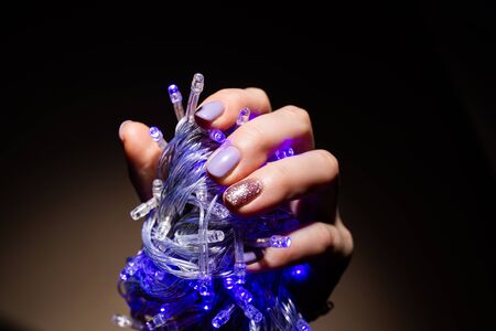 Nails Design. Hands With lilac color Summer Manicure On Grey Background. Close Up Of Female Hands. Art Nail.の写真素材
