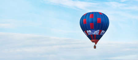 Hot air balloon over the blue skyの写真素材