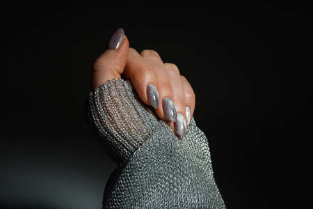 Nails Design. Hands With Bright Silver Christmas Manicure On Black Background. Close Up Of Female Hands. Art Nail.の写真素材
