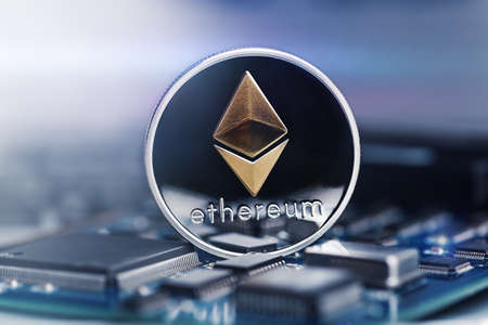 Ethereum crypto-currency on mainboard. Macro technology and computing concept.