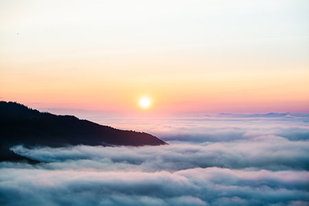 Mountains under mist in the morning in the Carpathian mountains, Ukraine, Europe. Dramatic scene....