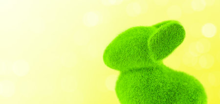 Green grass easter bunny rabbit on yellow spring backgroundの写真素材