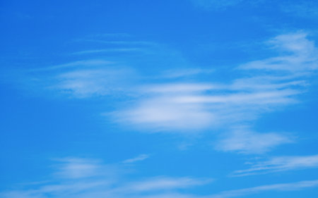 Peaceful blue sky background with light clouds, summer timeの写真素材