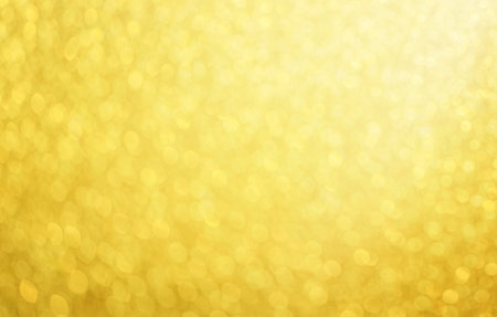 a beautifully abstract shiny gold bokeh backgroundの写真素材