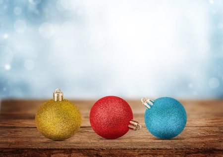 Christmas ornaments on wooden table on winter backgroundの写真素材