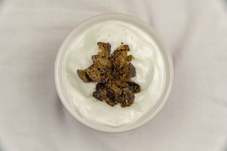 Overhead view of creamy dessert pudding with gingerbread on whiteの写真素材