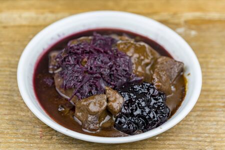 Close up view of a stew with red cabbage and cranberry sauceの写真素材