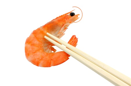 shrimp and chopsticks isolated on whiteの写真素材
