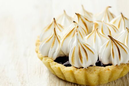 Tartlet with berry confiture and meringue horizontal close-upの写真素材