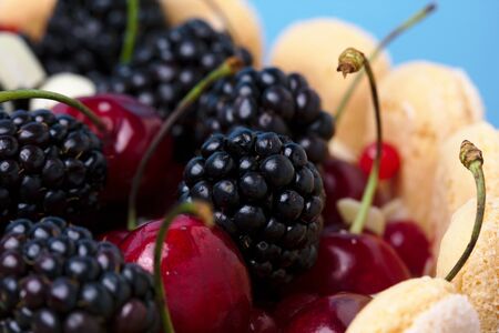Fresh blackberry and cherry fruit cake closeup