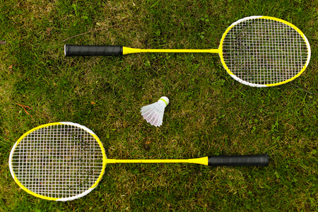 Badminton rackets on the green grassの写真素材