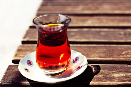 Turkish traditional cup tea on wooden table closeupの写真素材