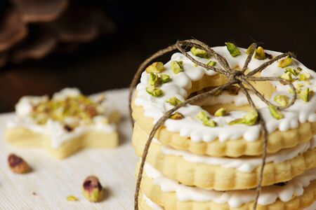 Wrapped like gift ring cookies in decorated christmas still life closeupの写真素材