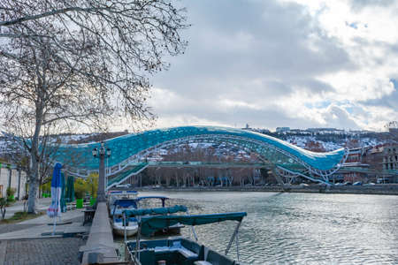 Tbilisi, Georgia. Bridge of Peace over the Kura River. A tourist route.の写真素材