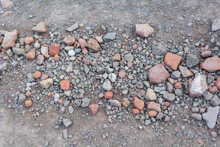 Pile of stone pebbles on the ground. Construction site.