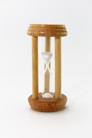 Wooden hourglass isolated on white background