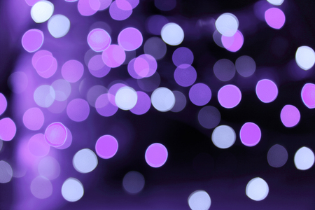 purple bokeh on dark backgroundの写真素材