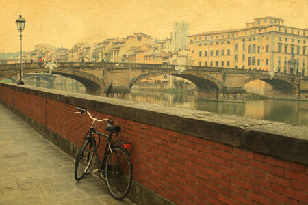 Vintage bridge on the river in Florence , Italyの写真素材