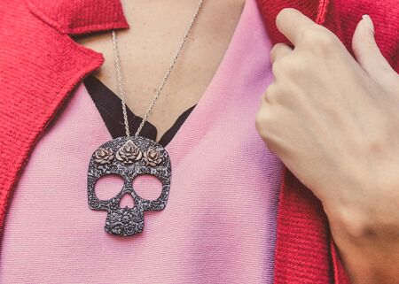 necklace with skull on womanの写真素材