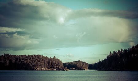 Vintage toned image of lake and forest, Finlandの写真素材
