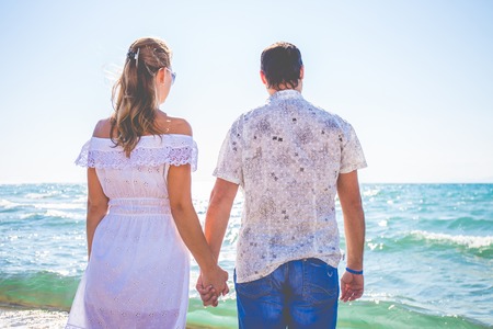 enamored man and woman posing in different placesの写真素材