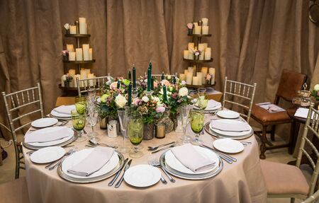 bridal luxury decorated table with flowers and candelsの写真素材